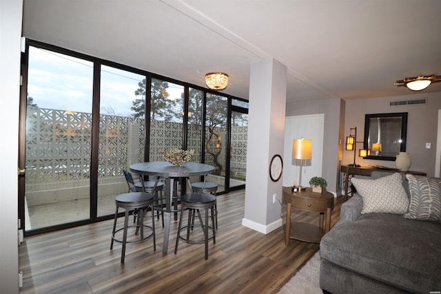 740 Weston Rd Unit 102, Hot Springs, AR 71913 - living area with floor to ceiling windows, baseboards, visible vents, and wood finished floors