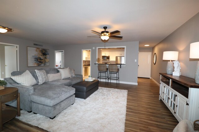 740 Weston Rd Unit 102, Hot Springs, AR 71913 - living room with visible vents, baseboards, a ceiling fan, and dark wood-style floors