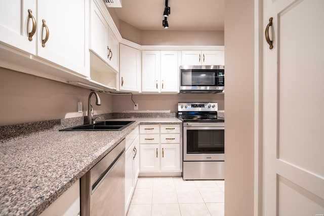 740 Weston Rd Unit 102, Hot Springs, AR 71913 - kitchen with a sink, light tile patterned flooring, white cabinetry, and appliances with stainless steel finishes