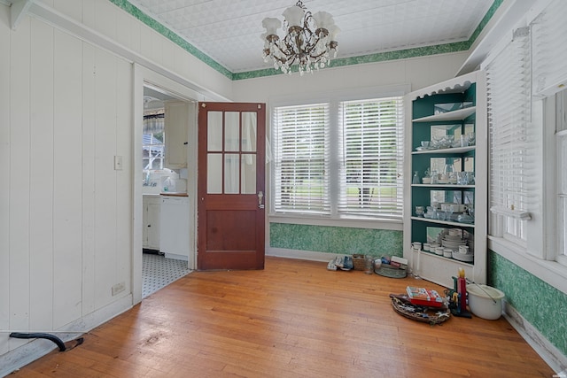 dining area with a chandelier and wood finished floors