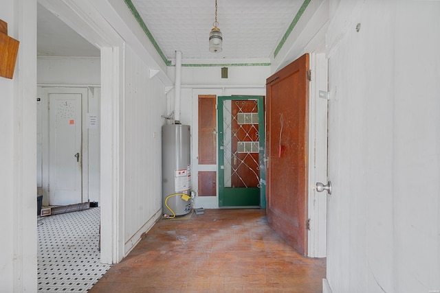 hallway featuring water heater and wood finished floors