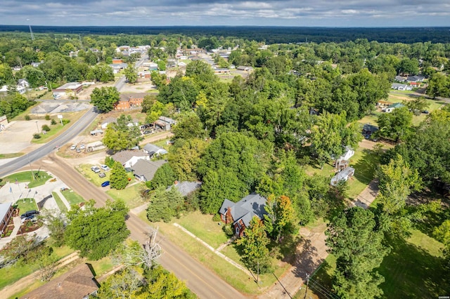 aerial view featuring a forest view and a residential view