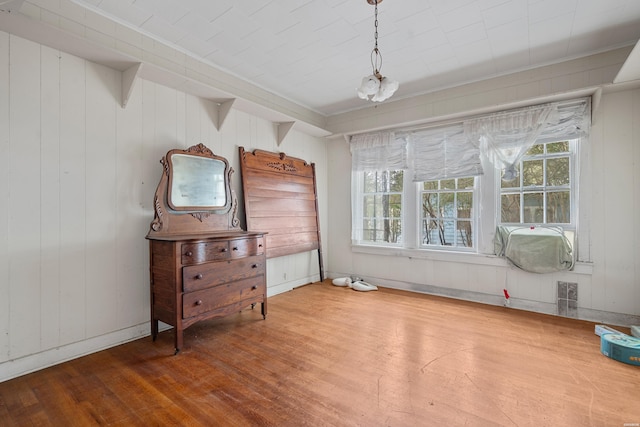 bedroom with wood finished floors