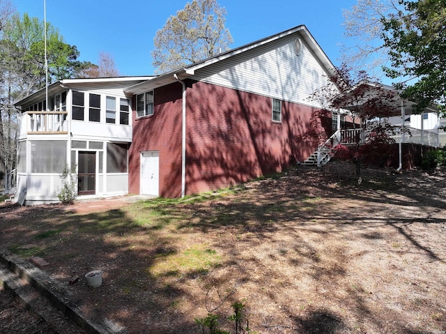 221 Perry St, Glenwood, AR 71943 - back of property featuring a sunroom