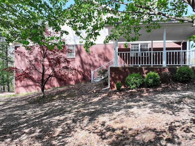 221 Perry St, Glenwood, AR 71943 - back of house with brick siding and covered porch