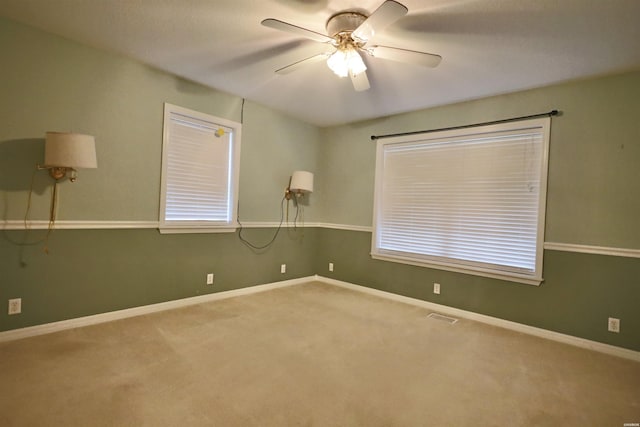 221 Perry St, Glenwood, AR 71943 - carpeted empty room with baseboards, ceiling fan, and visible vents