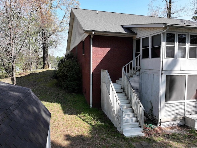 221 Perry St, Glenwood, AR 71943 - view of property exterior featuring a sunroom, stairs, brick siding, and a yard