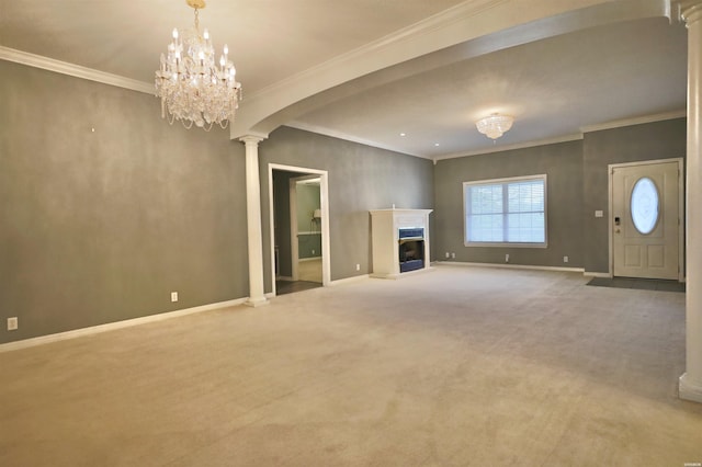 221 Perry St, Glenwood, AR 71943 - unfurnished living room with crown molding, ornate columns, baseboards, arched walkways, and carpet floors