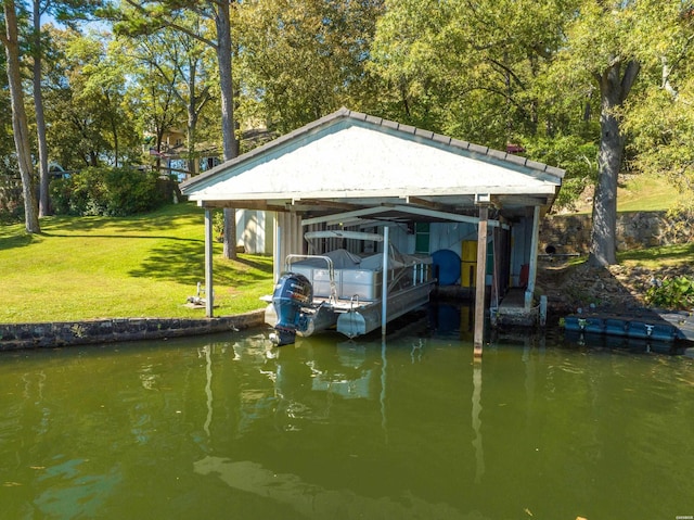 view of dock with a yard and a water view