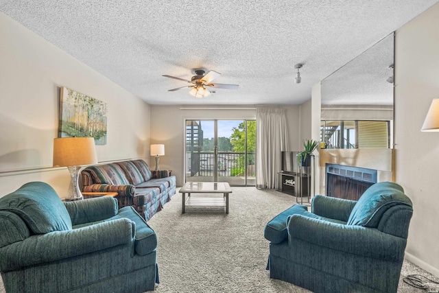 5371 Central Ave Unit 5H, Hot Springs, AR 71913 - carpeted living room featuring a ceiling fan, a textured ceiling, and a fireplace