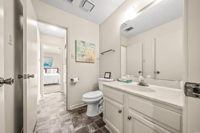 5371 Central Ave Unit 5H, Hot Springs, AR 71913 - bathroom with vanity, connected bathroom, stone finish flooring, and a textured ceiling