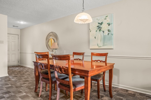 5371 Central Ave Unit 5H, Hot Springs, AR 71913 - dining space featuring a textured ceiling and baseboards