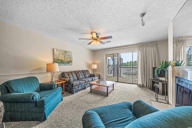 5371 Central Ave Unit 5H, Hot Springs, AR 71913 - living area with carpet, ceiling fan, a fireplace, and a textured ceiling