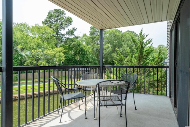 5371 Central Ave Unit 5H, Hot Springs, AR 71913 - balcony featuring outdoor dining area and view of scattered trees