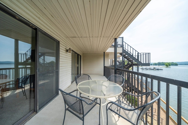 5371 Central Ave Unit 5H, Hot Springs, AR 71913 - balcony with stairs, a water view, and outdoor dining area