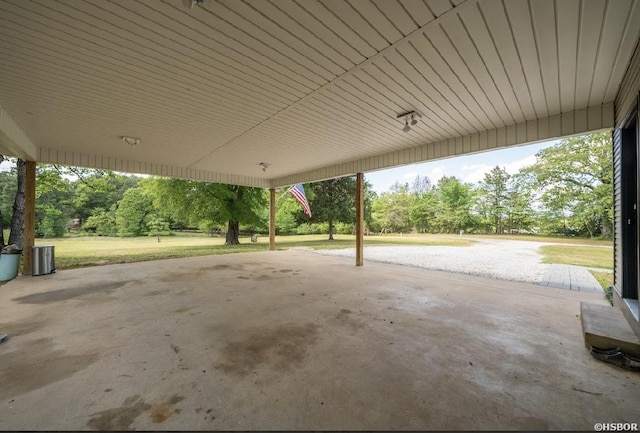 136 Ami Jo Dr, Hot Springs, AR 71913 - view of patio / terrace with central AC, view of wooded area, and an attached carport