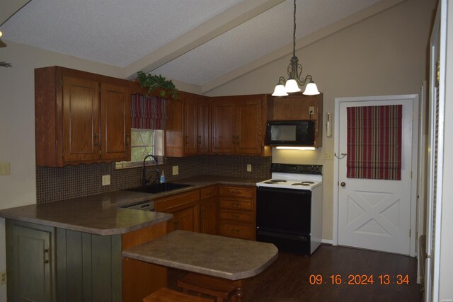 kitchen with range with electric cooktop, a peninsula, hanging light fixtures, black microwave, and a sink