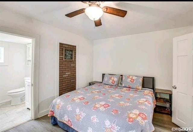 bedroom with ensuite bath, ceiling fan, and wood finished floors