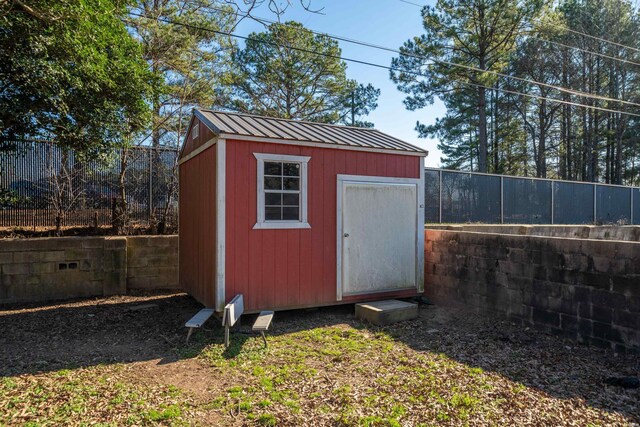 view of shed featuring a fenced backyard