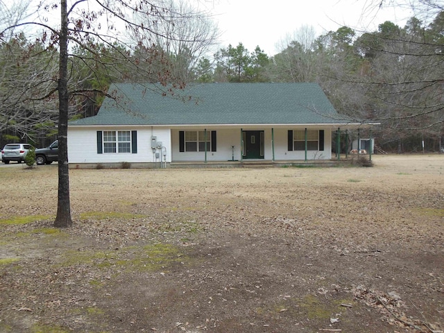 view of front of home with covered porch and roof with shingles