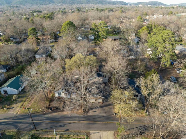 birds eye view of property featuring a forest view