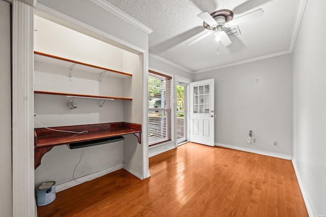201 Audubon St Unit 1003, Hot Springs, AR 71913 - unfurnished office featuring wood finished floors, ceiling fan, baseboards, a textured ceiling, and ornamental molding
