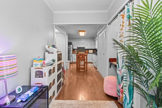201 Audubon St Unit 1003, Hot Springs, AR 71913 - hallway with light wood finished floors and crown molding