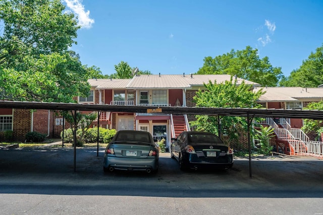 201 Audubon St Unit 1003, Hot Springs, AR 71913 - view of front of house with stairway, covered parking, and brick siding