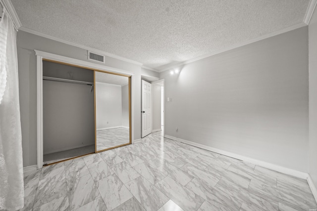 201 Audubon St Unit 1003, Hot Springs, AR 71913 - unfurnished bedroom featuring marble finish floors, a textured ceiling, ornamental molding, a closet, and baseboards