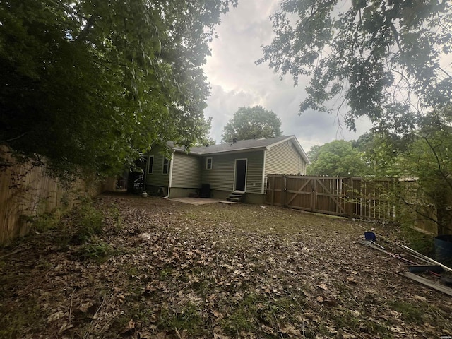 22 Irish Rose Cir, Alexander, AR 72002 - rear view of house with entry steps, a patio, and a gate