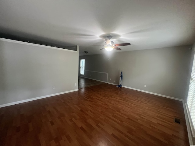 22 Irish Rose Cir, Alexander, AR 72002 - unfurnished room with a ceiling fan, dark wood-style floors, and baseboards