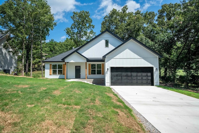 modern farmhouse featuring roof with shingles, an attached garage, driveway, and a front lawn