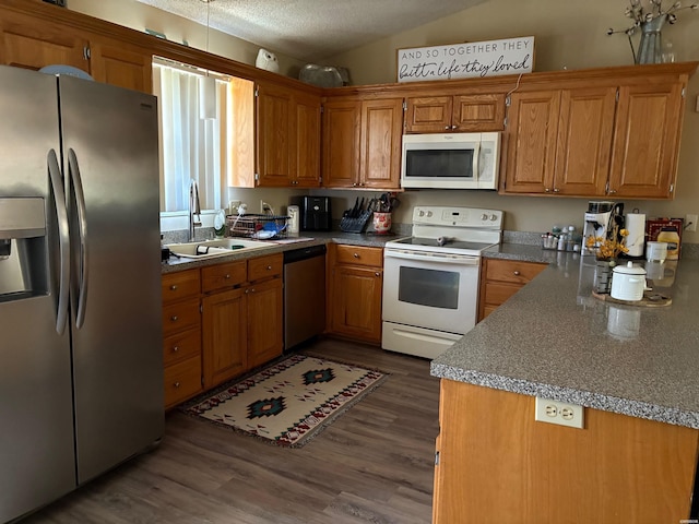 301 Halteria Ln Unit A, B, C, D, E, Hot Springs, AR 71913 - kitchen featuring dark wood-type flooring, brown cabinetry, appliances with stainless steel finishes, and a sink
