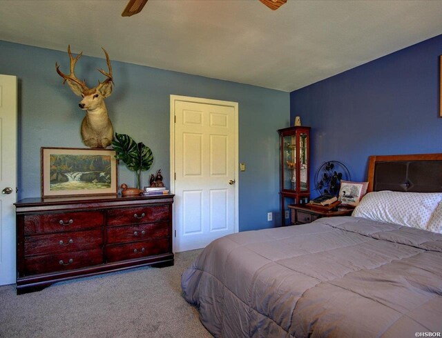 bedroom featuring light carpet