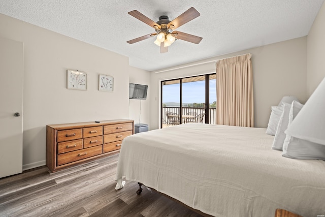 5371 Central Ave Unit 5L, Hot Springs, AR 71913 - bedroom with access to exterior, wood finished floors, a textured ceiling, and a ceiling fan