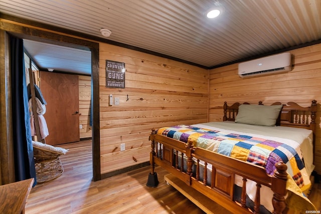 152 Anderson Loop, Amity, AR 71921 - bedroom with a wall unit AC, wooden walls, light wood-style flooring, wooden ceiling, and recessed lighting