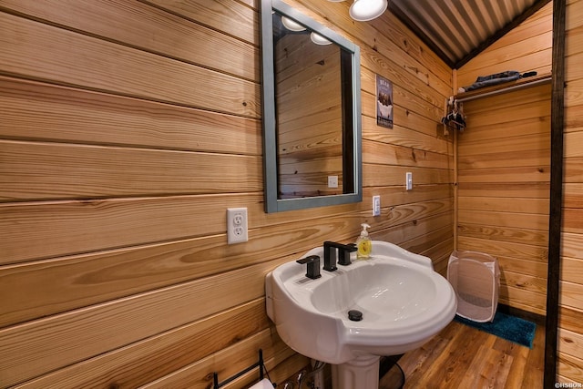 152 Anderson Loop, Amity, AR 71921 - bathroom featuring wood walls, lofted ceiling, and wood finished floors
