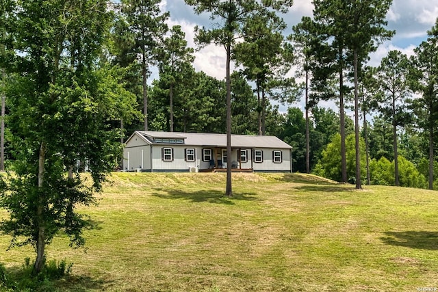152 Anderson Loop, Amity, AR 71921 - single story home with a front lawn and view of scattered trees