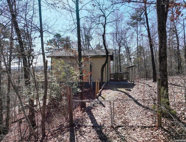 view of side of home featuring a gate