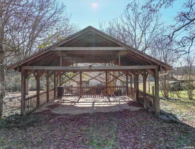 surrounding community featuring a detached carport