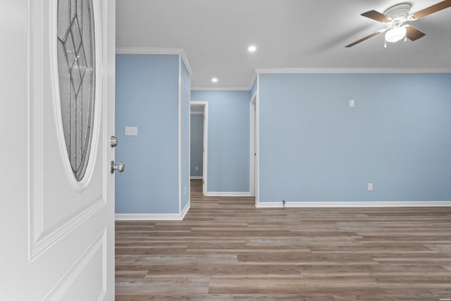 interior space with light wood finished floors, baseboards, ceiling fan, crown molding, and recessed lighting