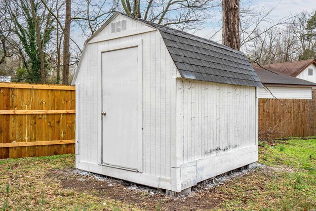 view of shed with fence