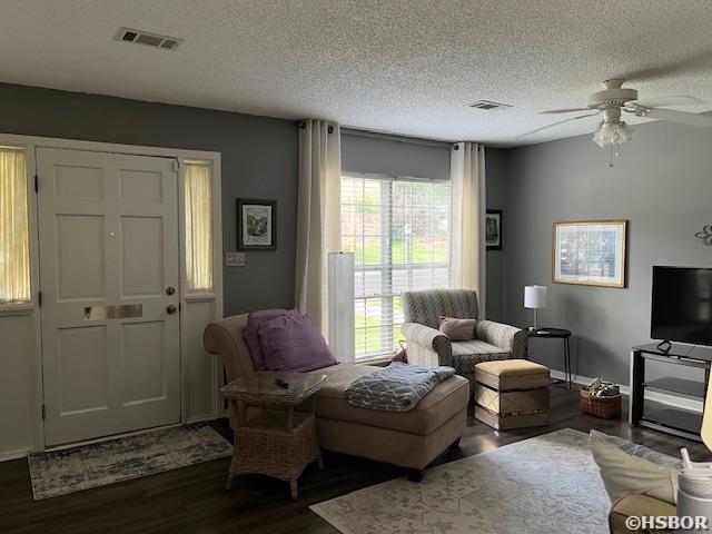 600 Higdon Ferry Rd, Hot Springs, AR 71913 - living room with dark wood-type flooring, a ceiling fan, and a textured ceiling