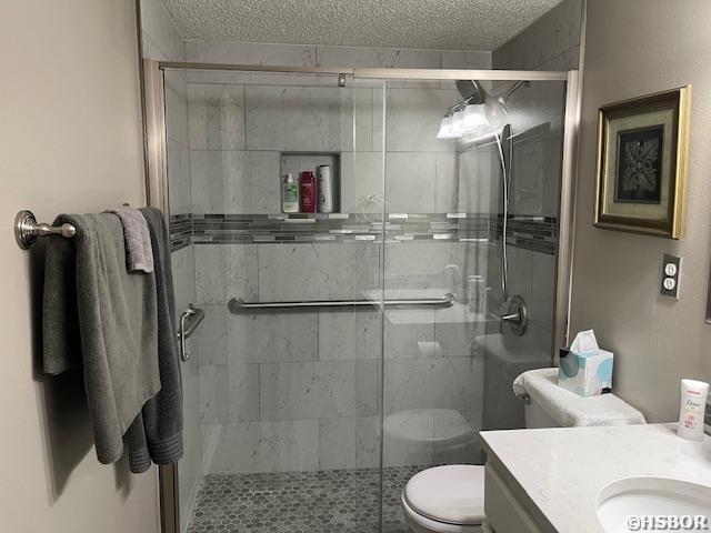 600 Higdon Ferry Rd, Hot Springs, AR 71913 - bathroom featuring vanity, a stall shower, and a textured ceiling