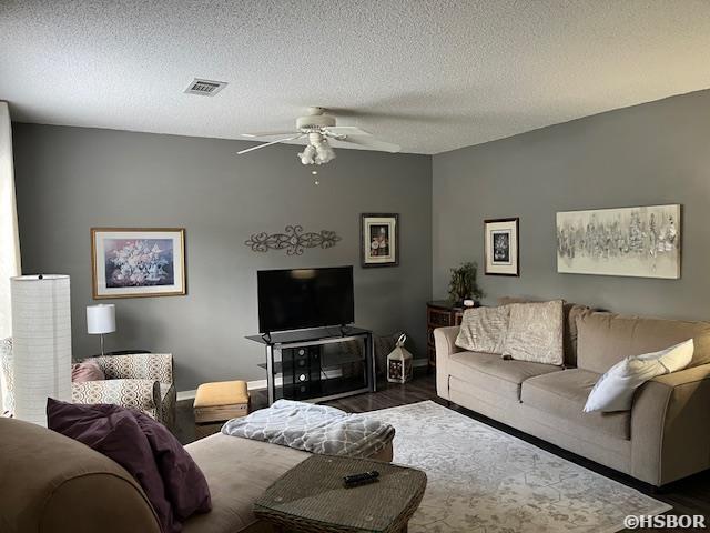 600 Higdon Ferry Rd, Hot Springs, AR 71913 - living area with wood finished floors, ceiling fan, and a textured ceiling