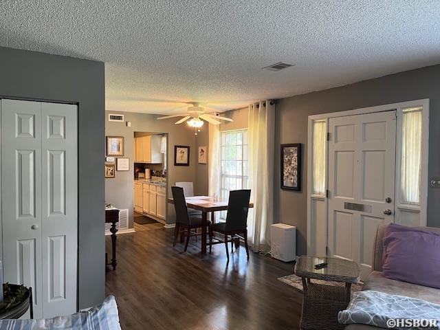 600 Higdon Ferry Rd, Hot Springs, AR 71913 - dining room with a textured ceiling, dark wood-style flooring, and ceiling fan