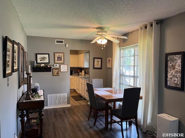 600 Higdon Ferry Rd, Hot Springs, AR 71913 - dining space featuring a textured ceiling, dark wood-style flooring, and ceiling fan