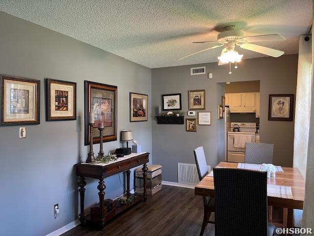 600 Higdon Ferry Rd, Hot Springs, AR 71913 - dining area with a ceiling fan, dark wood-style floors, and a textured ceiling