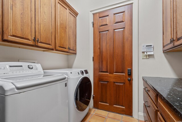 498 Lantern Ter, Hot Springs, AR 71913 - clothes washing area with cabinet space, washer and clothes dryer, and light tile patterned flooring