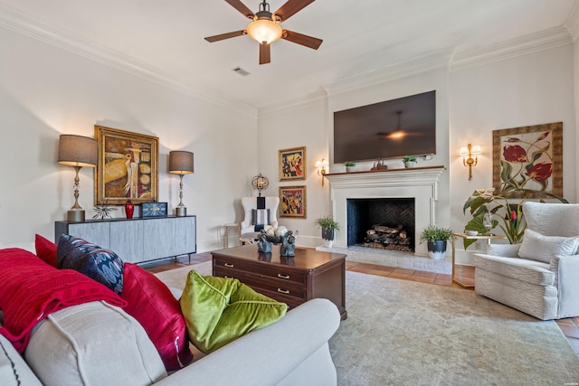 498 Lantern Ter, Hot Springs, AR 71913 - living room with crown molding, ceiling fan, a fireplace with raised hearth, and tile patterned floors
